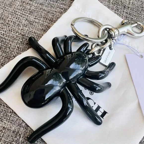 Coach Spider Bag Charm NWT CAX79 - ๐๐จ๐ฅ๐ ๐๐ฎ๐ญ ๐๐๐ซ๐จ๐ฌ๐ฌ ๐๐จ๐๐๐ก! - Picture 9 of 13